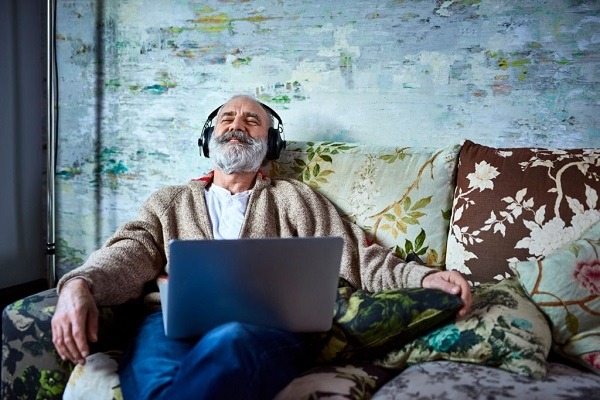 man listening to loud music on his headphones can cause hearing loss