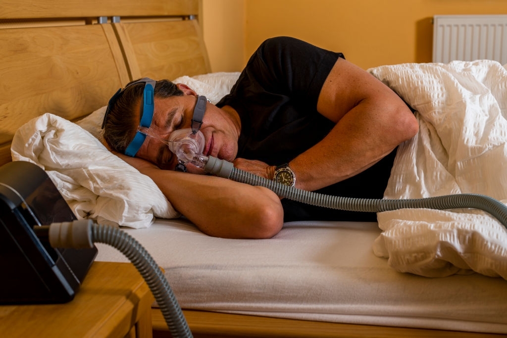 man suffering from obstructive sleep apnea