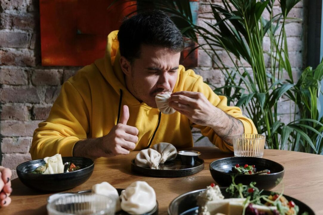 man eating food at restaurant